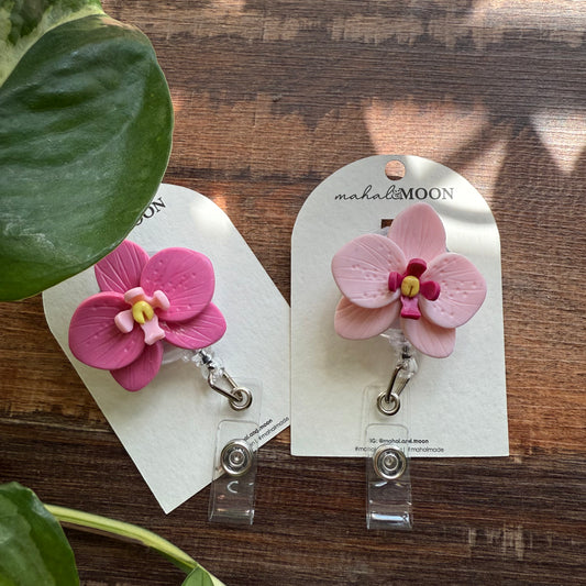 Orchid badge reel