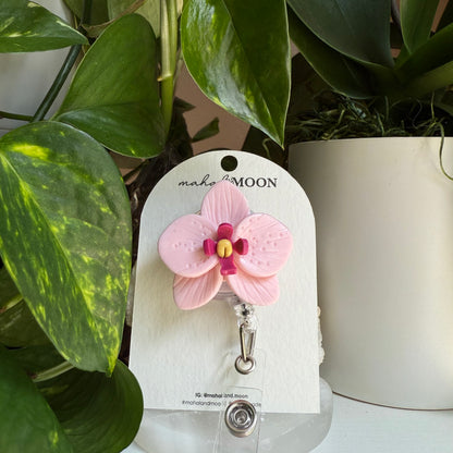 Orchid badge reel