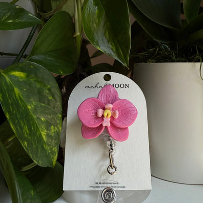 Orchid badge reel